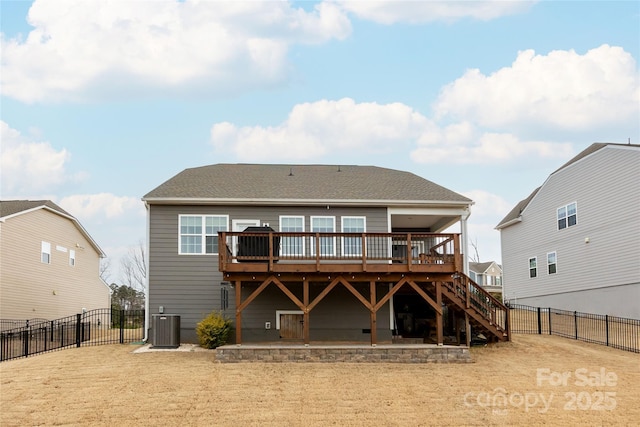 back of property featuring a gate, central AC unit, a fenced backyard, stairs, and a deck