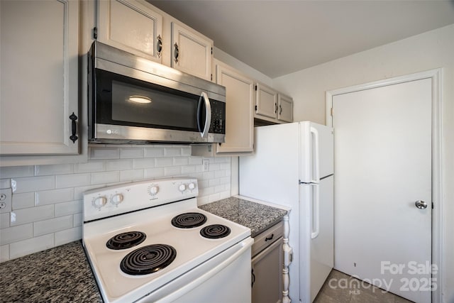 kitchen featuring white appliances and backsplash