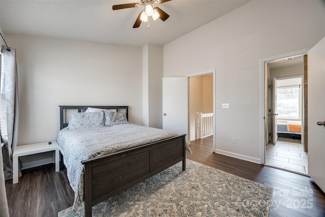 bedroom with ceiling fan, baseboards, and wood finished floors