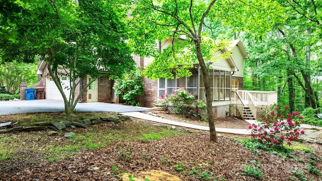 1080 Rolling Green Dr, Newton, NC 28658 - view of front of home featuring a sunroom, brick siding, and driveway