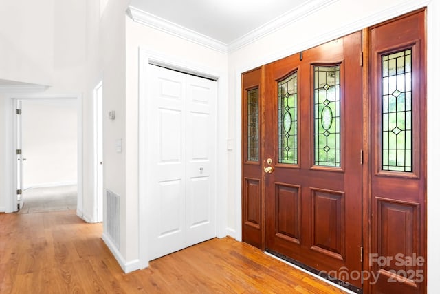 1080 Rolling Green Dr, Newton, NC 28658 - entrance foyer featuring light wood-style flooring, baseboards, and crown molding