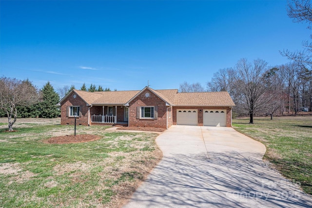 ranch-style house featuring concrete driveway, brick siding, a garage, and a front lawn