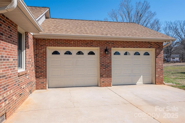 garage featuring driveway