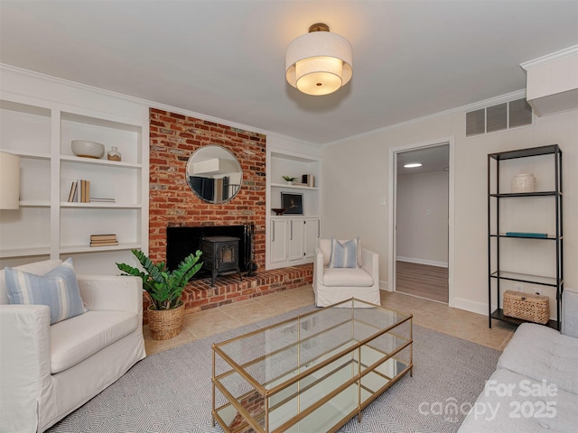 tiled living room featuring a wood stove, built in features, visible vents, and ornamental molding