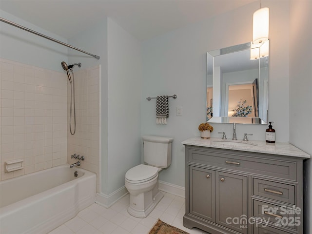 full bathroom with tile patterned flooring, toilet, vanity, and baseboards