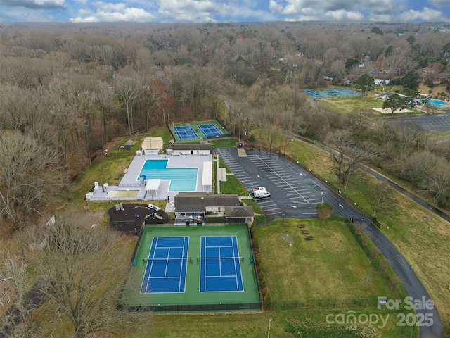 drone / aerial view with a view of trees