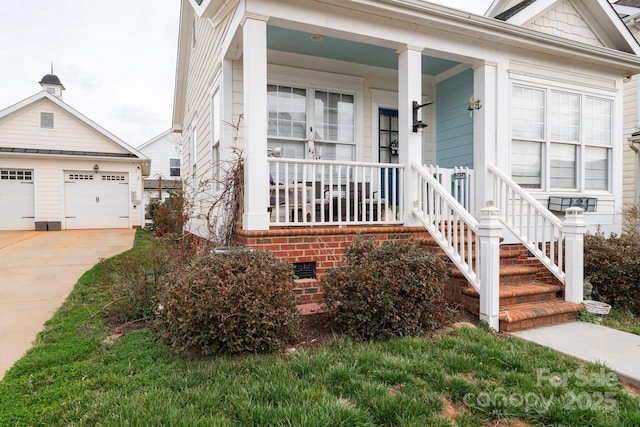 view of front of property featuring crawl space, covered porch, and a garage