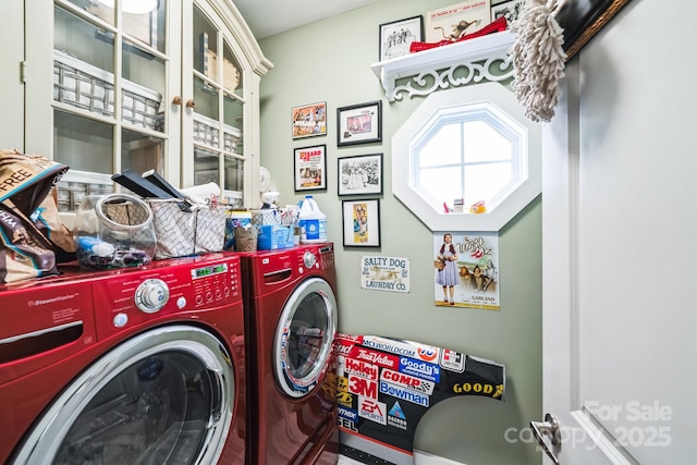 washroom featuring independent washer and dryer and laundry area