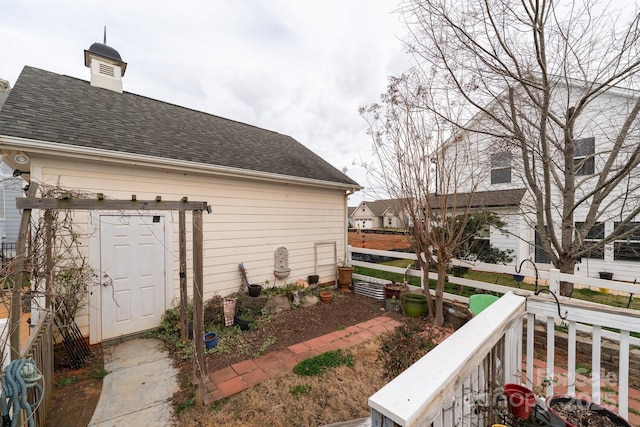 view of home's exterior featuring roof with shingles