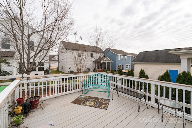 wooden deck featuring a residential view