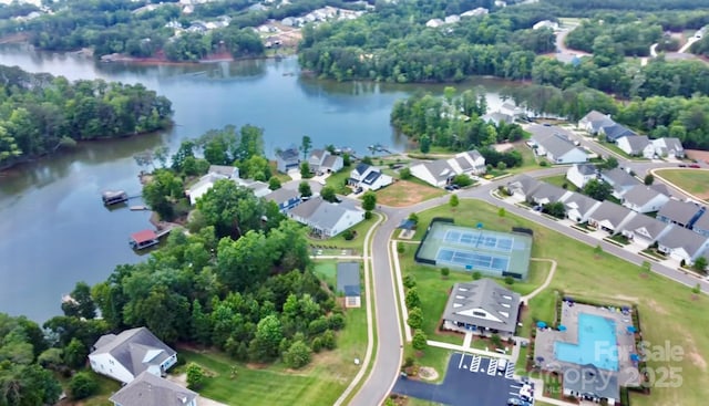 birds eye view of property featuring a water view and a residential view