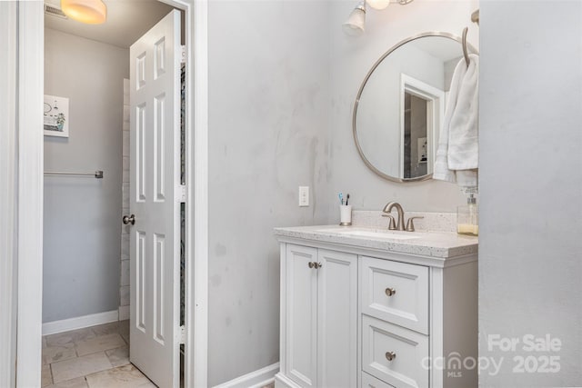 bathroom featuring vanity and baseboards