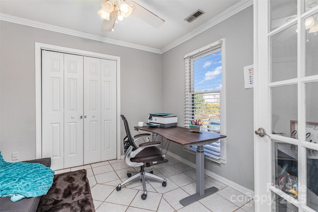 office with visible vents, baseboards, light tile patterned flooring, and crown molding