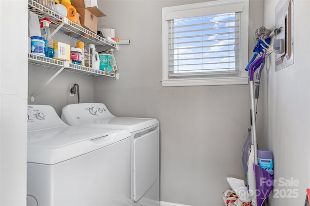 clothes washing area with laundry area and washer and dryer