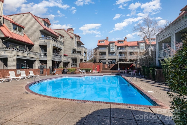 community pool with a patio area