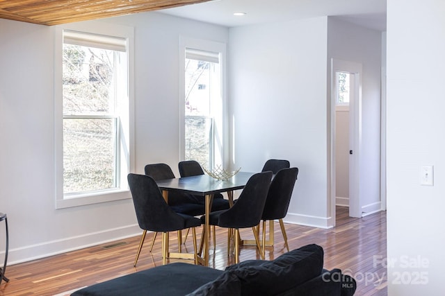 dining room featuring recessed lighting, visible vents, baseboards, and wood finished floors