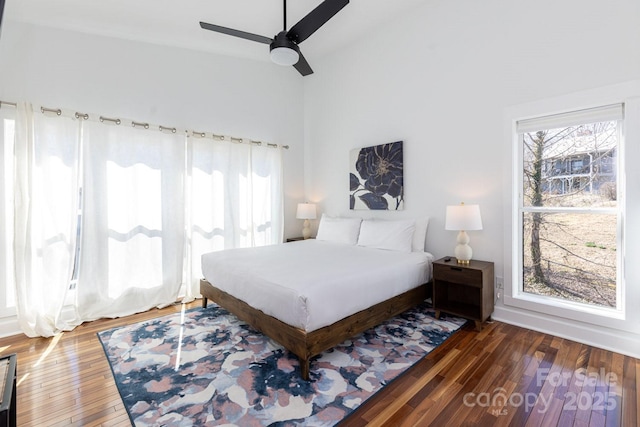 bedroom with ceiling fan and wood-type flooring