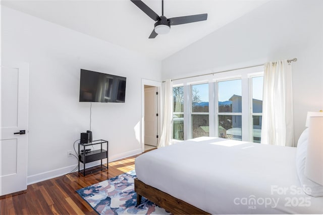 bedroom with a ceiling fan, lofted ceiling, wood finished floors, and baseboards