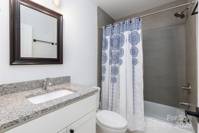 bathroom with vanity, toilet, and shower / tub combo with curtain