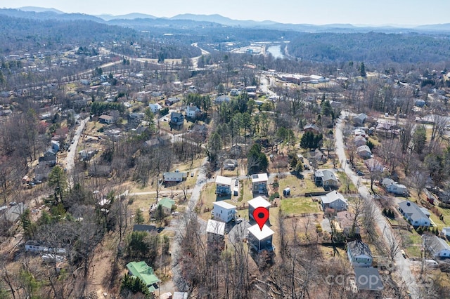 birds eye view of property with a mountain view