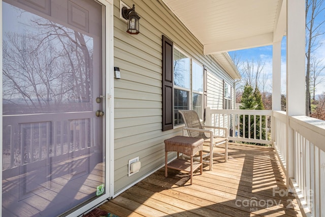 wooden terrace with a porch