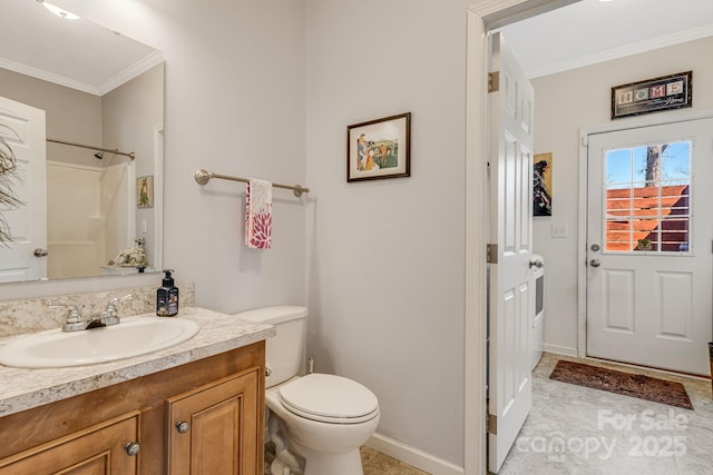 bathroom with toilet, crown molding, a shower, baseboards, and vanity