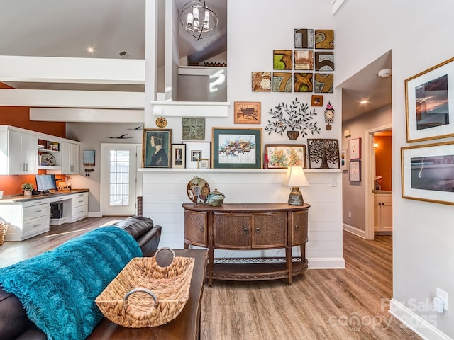 living area featuring wood finished floors and baseboards