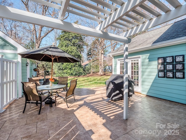 view of patio featuring outdoor dining space, area for grilling, and a pergola