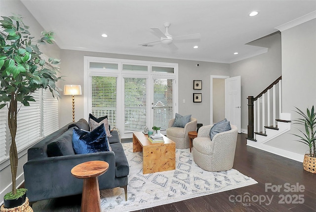 living room featuring ornamental molding, wood finished floors, recessed lighting, baseboards, and stairs