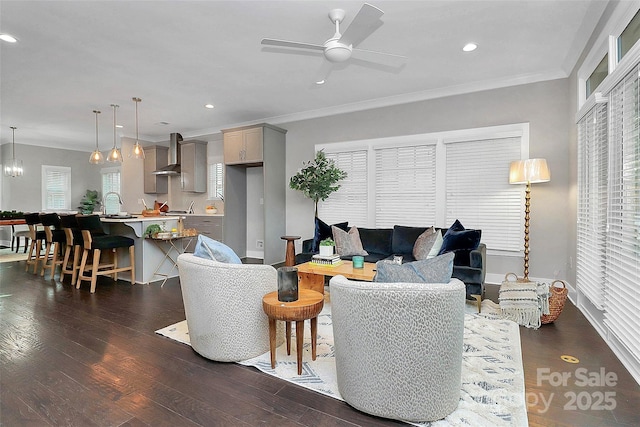 living area with recessed lighting, dark wood-type flooring, ceiling fan, and crown molding