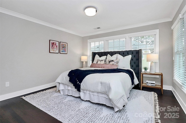 bedroom with visible vents, multiple windows, and ornamental molding