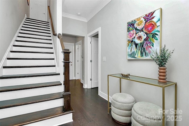 stairway with crown molding, baseboards, and wood finished floors