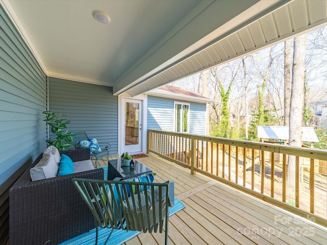 wooden deck featuring an outdoor hangout area