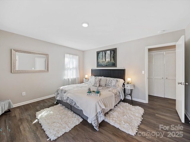 bedroom featuring wood finished floors and baseboards