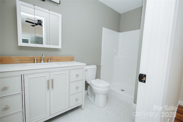 bathroom featuring a shower, a ceiling fan, toilet, and vanity