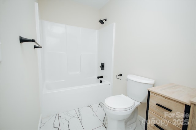 bathroom with bathing tub / shower combination, toilet, and marble finish floor