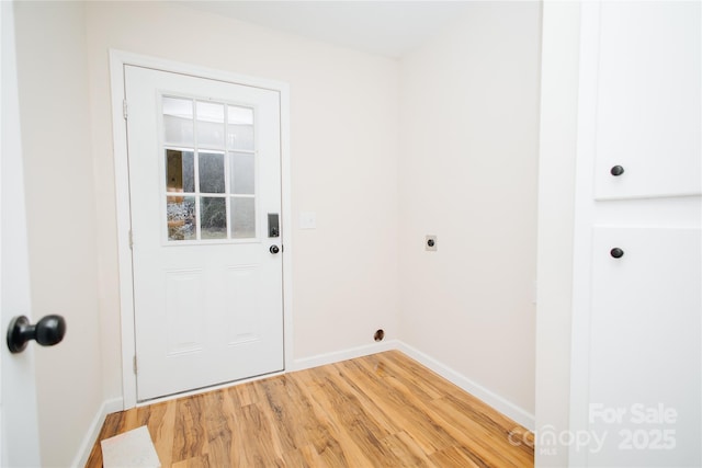 entryway with light wood-style floors and baseboards