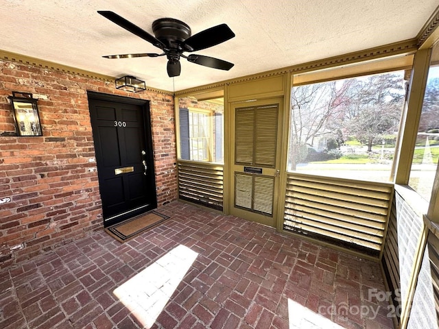 entrance to property with ceiling fan