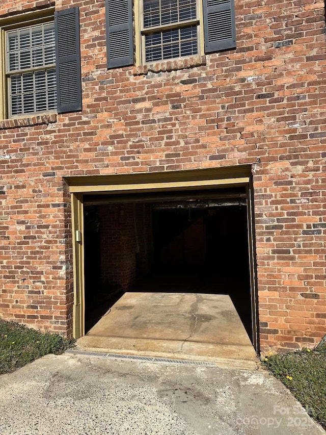 details with brick siding and driveway