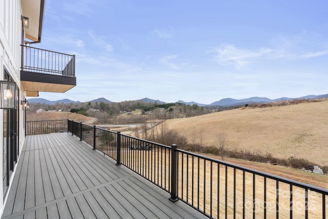 wooden terrace with a mountain view