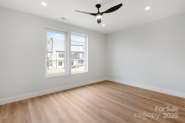 unfurnished room featuring visible vents, a ceiling fan, recessed lighting, light wood-style floors, and baseboards