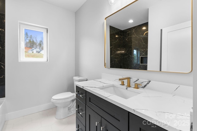 bathroom featuring vanity, toilet, baseboards, and a marble finish shower