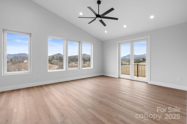 interior space featuring recessed lighting, a healthy amount of sunlight, and wood finished floors