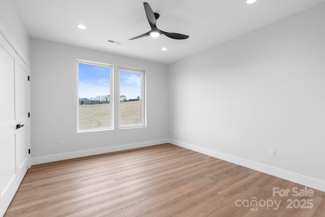 unfurnished bedroom with visible vents, baseboards, recessed lighting, light wood-style floors, and a ceiling fan