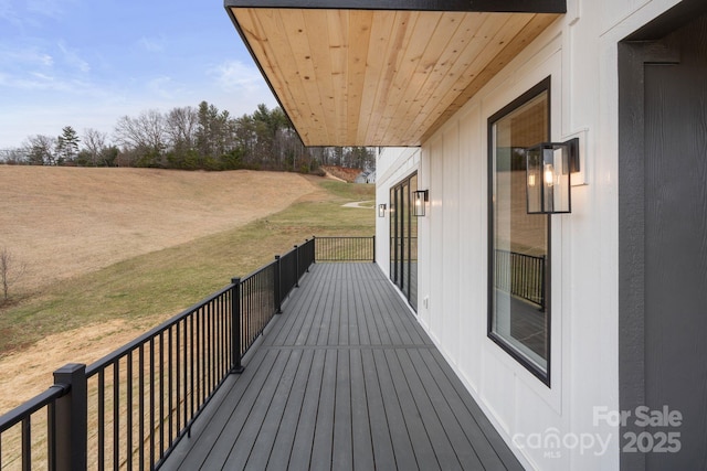 wooden deck with a yard