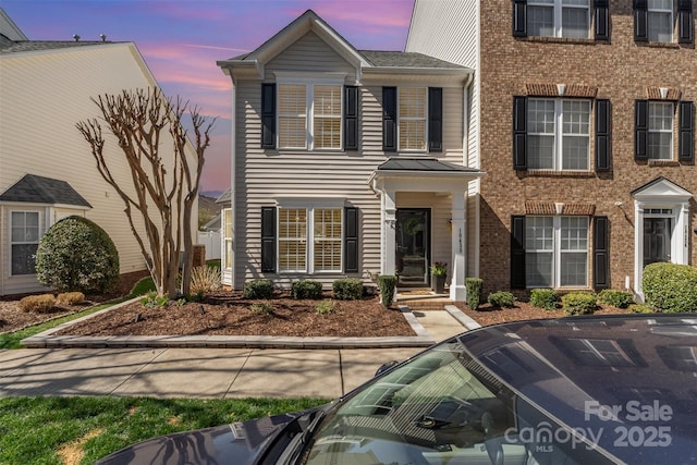 view of front of house featuring brick siding