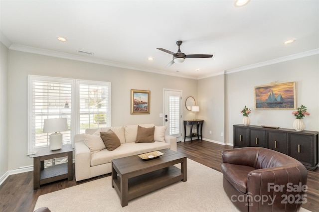 living area with visible vents, wood finished floors, recessed lighting, crown molding, and baseboards