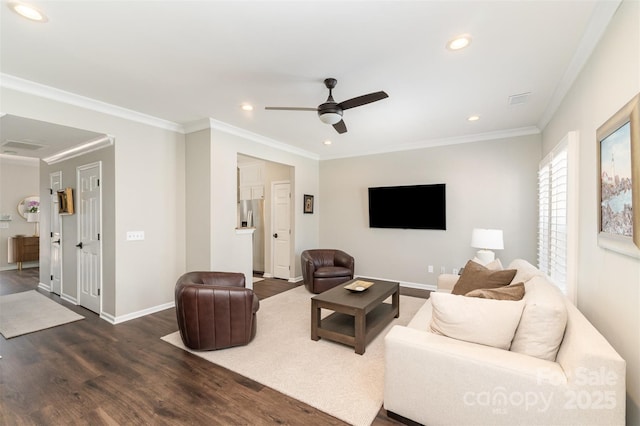 living room with recessed lighting, baseboards, dark wood-type flooring, and crown molding