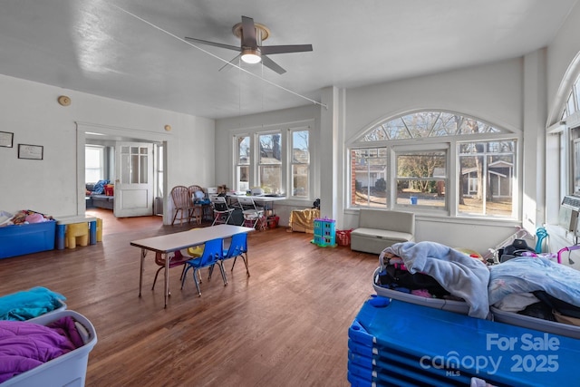 interior space featuring ceiling fan and wood finished floors