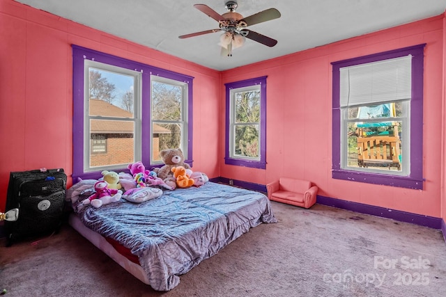 carpeted bedroom with a ceiling fan